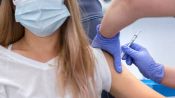 A woman receiving a vaccination.